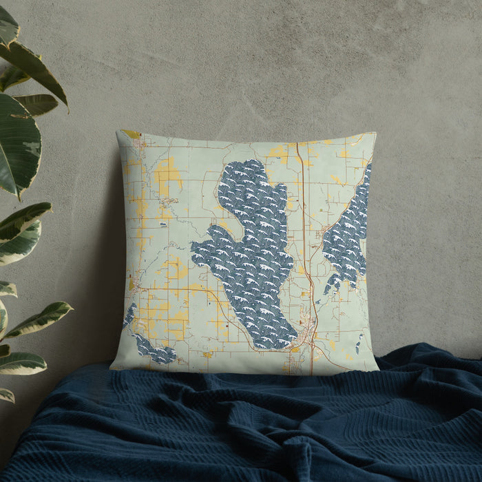 Custom Burt Lake Michigan Map Throw Pillow in Woodblock on Bedding Against Wall