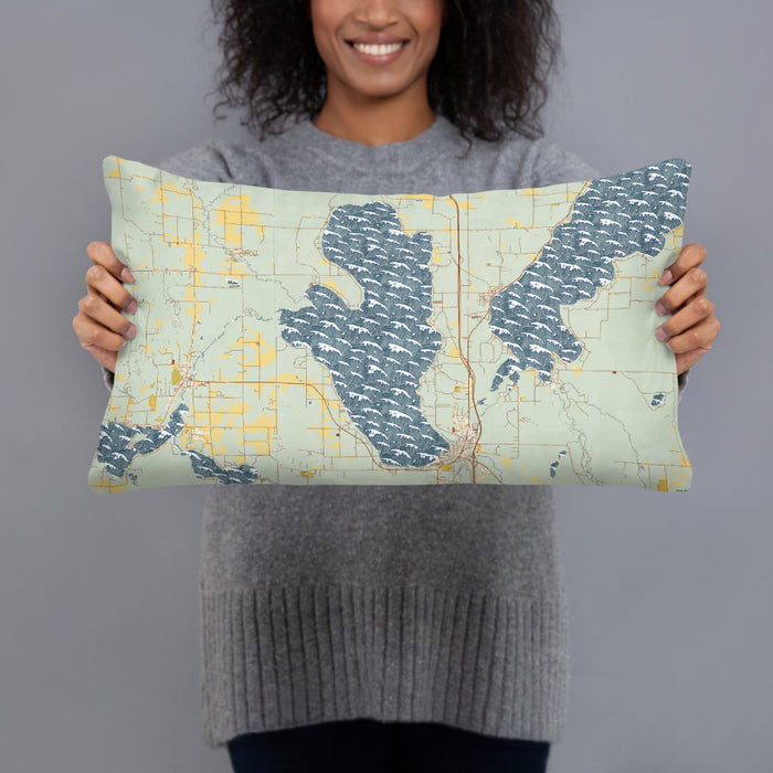 Person holding 20x12 Custom Burt Lake Michigan Map Throw Pillow in Woodblock