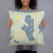 Person holding 18x18 Custom Burt Lake Michigan Map Throw Pillow in Woodblock