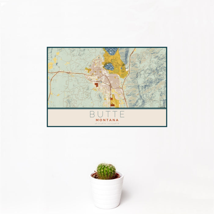 12x18 Butte Montana Map Print Landscape Orientation in Woodblock Style With Small Cactus Plant in White Planter