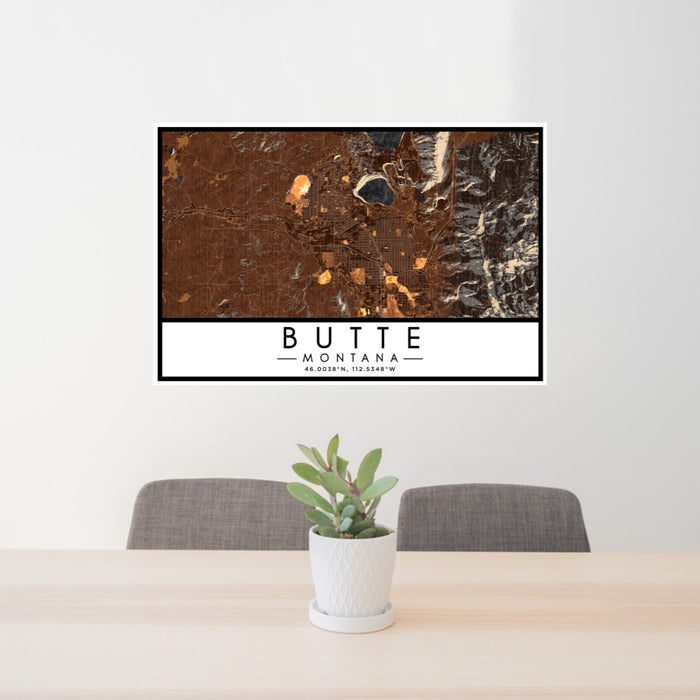 24x36 Butte Montana Map Print Lanscape Orientation in Ember Style Behind 2 Chairs Table and Potted Plant