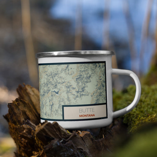 Right View Custom Butte Montana Map Enamel Mug in Woodblock on Grass With Trees in Background