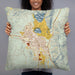 Person holding 22x22 Custom Butte Montana Map Throw Pillow in Woodblock