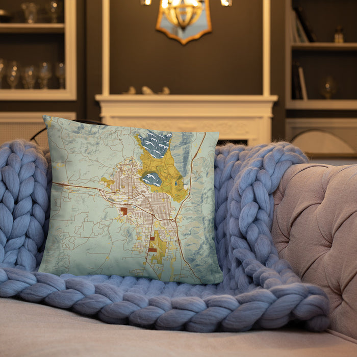 Custom Butte Montana Map Throw Pillow in Woodblock on Cream Colored Couch