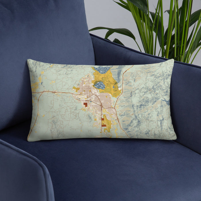 Custom Butte Montana Map Throw Pillow in Woodblock on Blue Colored Chair