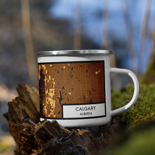 Right View Custom Calgary Alberta Map Enamel Mug in Ember on Grass With Trees in Background