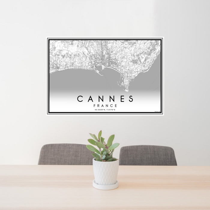 24x36 Cannes France Map Print Landscape Orientation in Classic Style Behind 2 Chairs Table and Potted Plant