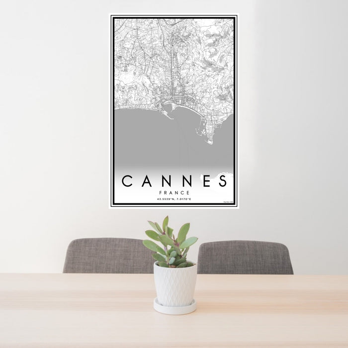 24x36 Cannes France Map Print Portrait Orientation in Classic Style Behind 2 Chairs Table and Potted Plant