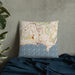 Custom Cannes France Map Throw Pillow in Woodblock on Bedding Against Wall