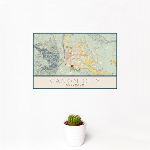 12x18 Cañon City Colorado Map Print Landscape Orientation in Woodblock Style With Small Cactus Plant in White Planter