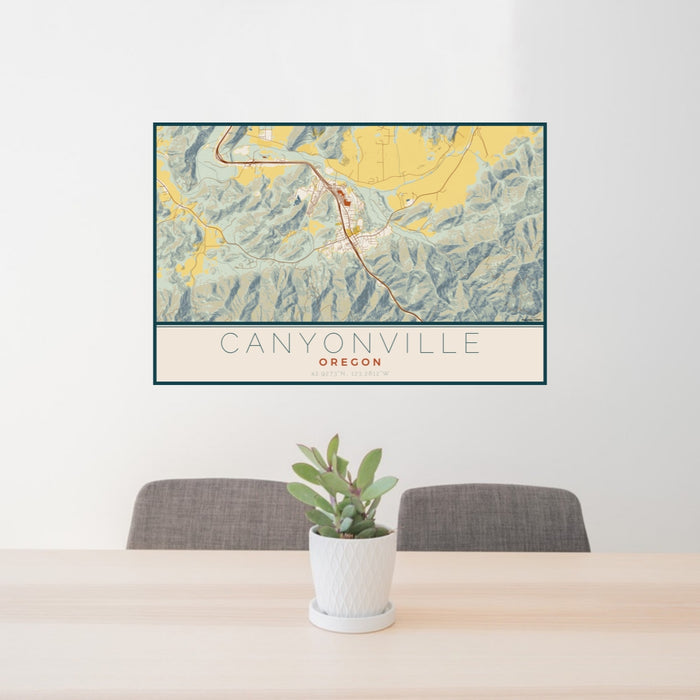 24x36 Canyonville Oregon Map Print Landscape Orientation in Woodblock Style Behind 2 Chairs Table and Potted Plant