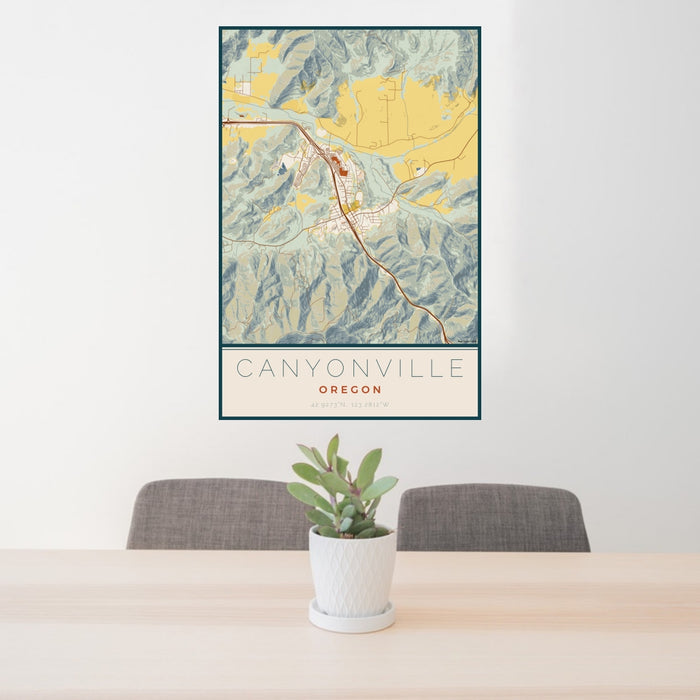 24x36 Canyonville Oregon Map Print Portrait Orientation in Woodblock Style Behind 2 Chairs Table and Potted Plant