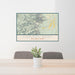 24x36 Capitol Reef National Park Map Print Lanscape Orientation in Woodblock Style Behind 2 Chairs Table and Potted Plant