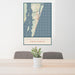 24x36 Carolina Beach North Carolina Map Print Portrait Orientation in Woodblock Style Behind 2 Chairs Table and Potted Plant
