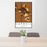 24x36 Carroll Iowa Map Print Portrait Orientation in Ember Style Behind 2 Chairs Table and Potted Plant
