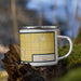 Right View Custom Carroll Iowa Map Enamel Mug in Woodblock on Grass With Trees in Background