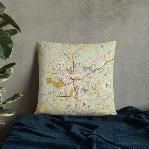 Custom Carrollton Georgia Map Throw Pillow in Woodblock on Bedding Against Wall