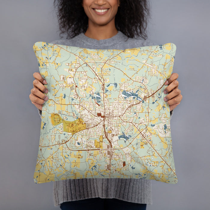 Person holding 18x18 Custom Carrollton Georgia Map Throw Pillow in Woodblock