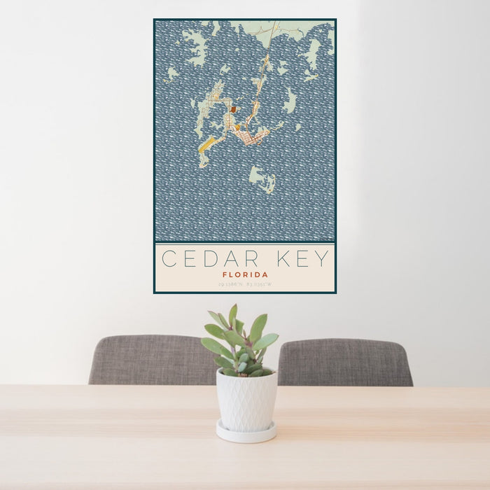 24x36 Cedar Key Florida Map Print Portrait Orientation in Woodblock Style Behind 2 Chairs Table and Potted Plant