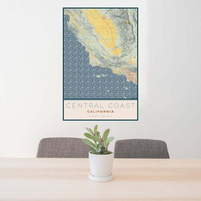 24x36 Central Coast California Map Print Portrait Orientation in Woodblock Style Behind 2 Chairs Table and Potted Plant