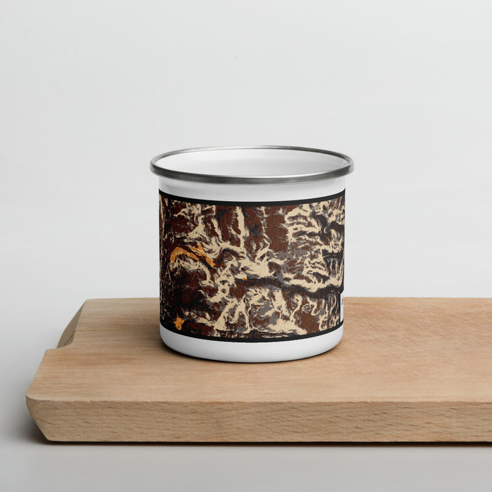 Front View Custom Cirque of the Towers Wyoming Map Enamel Mug in Ember on Cutting Board