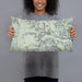 Person holding 20x12 Custom Cirque of the Towers Wyoming Map Throw Pillow in Woodblock