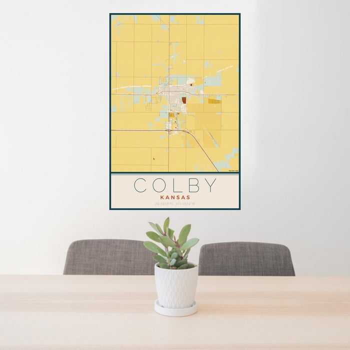 24x36 Colby Kansas Map Print Portrait Orientation in Woodblock Style Behind 2 Chairs Table and Potted Plant