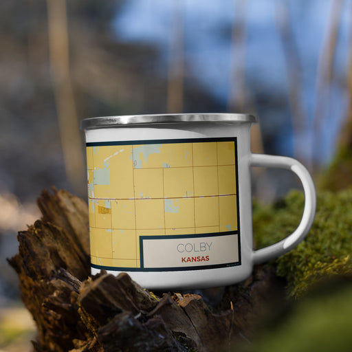 Right View Custom Colby Kansas Map Enamel Mug in Woodblock on Grass With Trees in Background