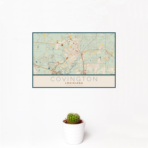 12x18 Covington Louisiana Map Print Landscape Orientation in Woodblock Style With Small Cactus Plant in White Planter