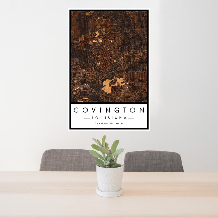24x36 Covington Louisiana Map Print Portrait Orientation in Ember Style Behind 2 Chairs Table and Potted Plant