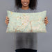 Person holding 20x12 Custom Covington Louisiana Map Throw Pillow in Woodblock