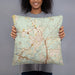 Person holding 18x18 Custom Covington Louisiana Map Throw Pillow in Woodblock