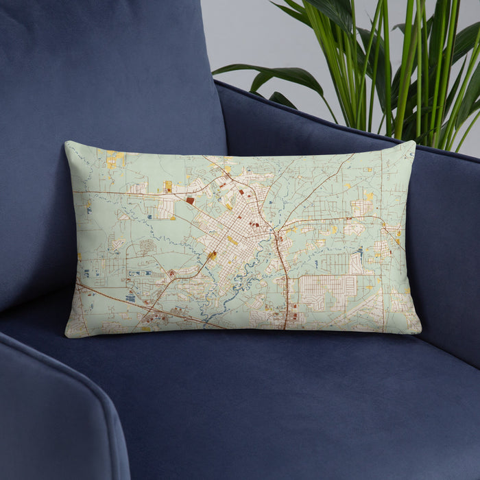 Custom Covington Louisiana Map Throw Pillow in Woodblock on Blue Colored Chair