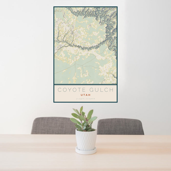 24x36 Coyote Gulch Utah Map Print Portrait Orientation in Woodblock Style Behind 2 Chairs Table and Potted Plant