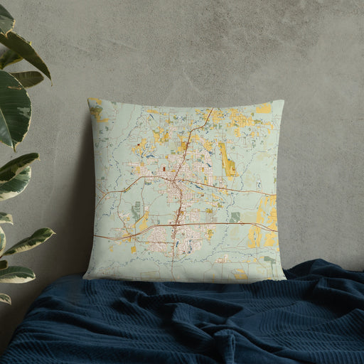 Custom Crestview Florida Map Throw Pillow in Woodblock on Bedding Against Wall