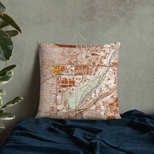 Custom Cultural District Fort Worth Map Throw Pillow in Woodblock on Bedding Against Wall
