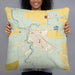 Person holding 22x22 Custom Cut Bank Montana Map Throw Pillow in Woodblock