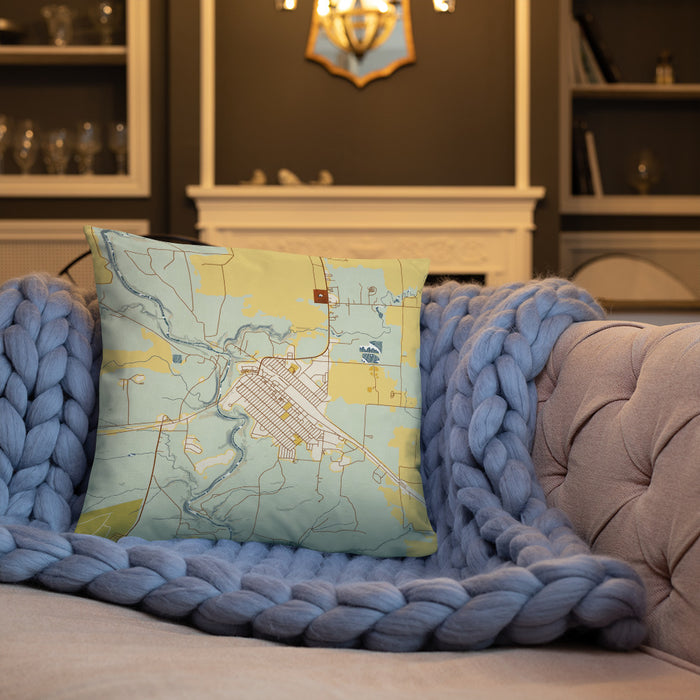 Custom Cut Bank Montana Map Throw Pillow in Woodblock on Cream Colored Couch