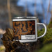 Right View Custom Dansville New York Map Enamel Mug in Ember on Grass With Trees in Background