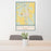 24x36 Deer Lodge Montana Map Print Portrait Orientation in Woodblock Style Behind 2 Chairs Table and Potted Plant