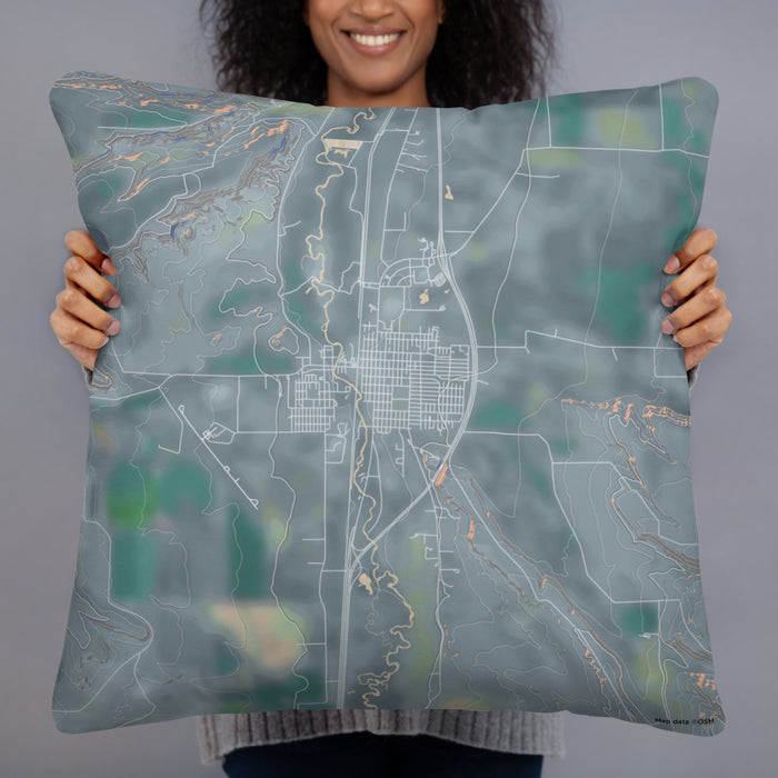 Person holding 22x22 Custom Deer Lodge Montana Map Throw Pillow in Afternoon
