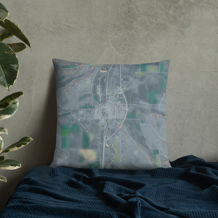 Custom Deer Lodge Montana Map Throw Pillow in Afternoon on Bedding Against Wall