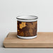 Front View Custom Deer Lodge Montana Map Enamel Mug in Ember on Cutting Board