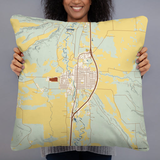 Person holding 22x22 Custom Deer Lodge Montana Map Throw Pillow in Woodblock