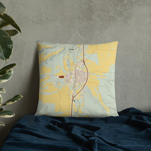 Custom Deer Lodge Montana Map Throw Pillow in Woodblock on Bedding Against Wall