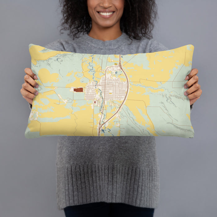 Person holding 20x12 Custom Deer Lodge Montana Map Throw Pillow in Woodblock