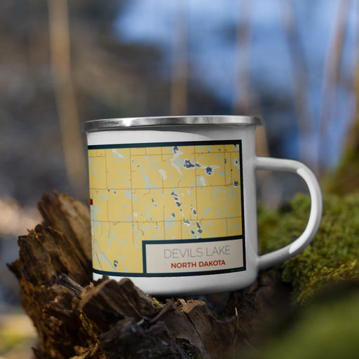Right View Custom Devils Lake North Dakota Map Enamel Mug in Woodblock on Grass With Trees in Background