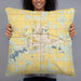 Person holding 22x22 Custom Dickinson North Dakota Map Throw Pillow in Woodblock