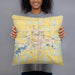 Person holding 18x18 Custom Dickinson North Dakota Map Throw Pillow in Woodblock