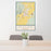 24x36 Dillon Montana Map Print Portrait Orientation in Woodblock Style Behind 2 Chairs Table and Potted Plant